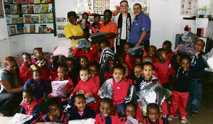 abrice Facar, Goodwill Ambassador for Children in the Vaal, recently visited the Makhula Creche in Vanderbijlpark and put a big smile on the faces of teachers, principal and little ones’ faces when he graced them with his presence and donated some goodies. Facar’s message is: “Each child is special and needs to be protected at all times. I urge the community of the Vaal to spare a thought for the less privileged and give what is in one’s own means. The greatest gift you can give anyone is your time. This is my last community project since I’m leaving for Europe later this month.” Pictured at the back from left are: Mam Makhula (principal), Grace Mutemachani (teacher), Fabrice Facar and Walter Jones. Photo: Lazarus Dithagiso