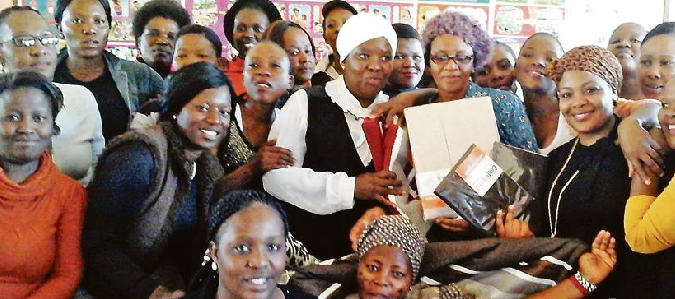 The Healing Hands Organisation recently bid farewell to their longest serving member, Maria Ntshala (center in glasses), in style. Ntshala (65) served the organisation with pride as a care-giver for 10 years since its formation as Kopano Ke Matla in 2006. She is seen here with other members of the organisation. Photo: Supplied