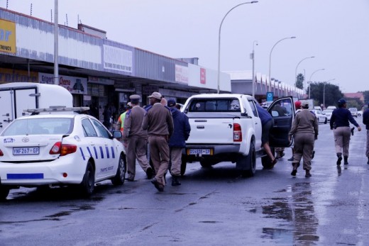 Several Police stations and traffic officials raided shops this morning April 21 in Attie Fourie street in search of counterfeit goods. Photo: Jannie du Plessis