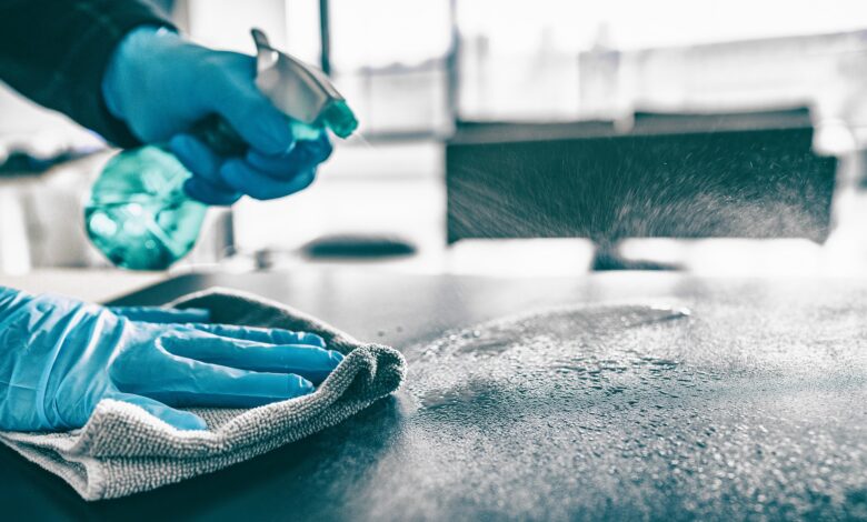 Cleaning,Home,Table,Sanitizing,Kitchen,Table,Surface,With,Disinfectant,Spray