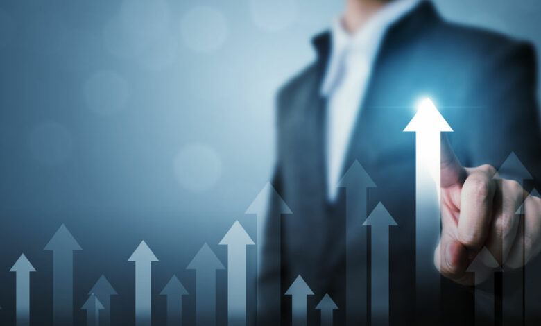 Business development to success and growing growth concept. Businessman pointing arrow graph corporate future growth plan and increase percentage
