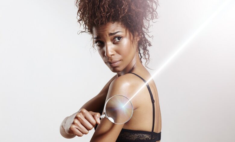 Woman,With,Lens,And,Ray,Of,Laser.,Spf,Concept,,Sun