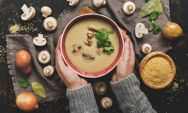 Women,Hands,In,A,Gray,Sweater,Holding,A,Bowl,Of