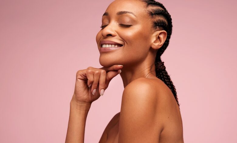Close,Up,Of,Beautiful,Woman,With,Hand,On,Chin.,African