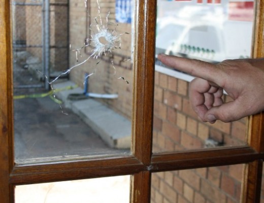 One of the windows in the charge office of SAPS Dunnottar, which pays evidence of a shooting spree that occurred on June 8