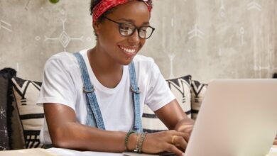 stylish-businesswoman-works-laptop-computer-cozy-coffee-shop-keyboards-information_273609-44481