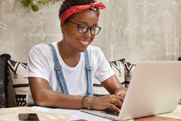 stylish-businesswoman-works-laptop-computer-cozy-coffee-shop-keyboards-information_273609-44481