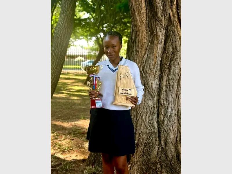 Mandisa Tshabalala walked away with three certificates and trophy at the Sedibeng East District prize-giving ceremony after being named the top achiever.