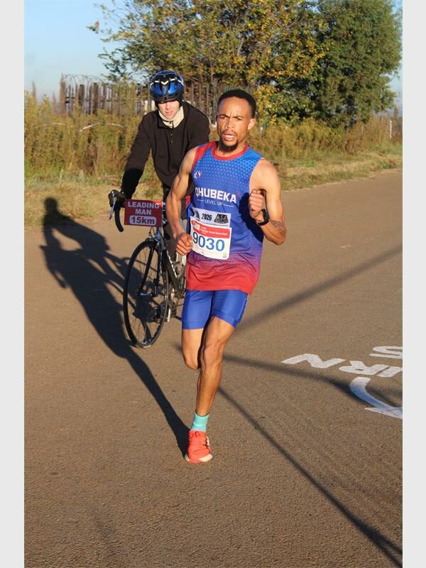 He clocked a personal best 49:00 to win his third consecutive men's 15km race.