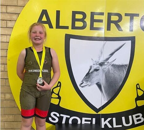 Young athletes return with impressive medal haul following stellar performances across multiple divisions.