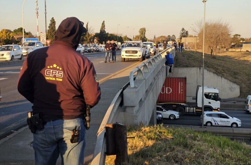 Traffic halted as authorities negotiate with man in crisis; experts urge mental health awareness during Men’s Health Month.