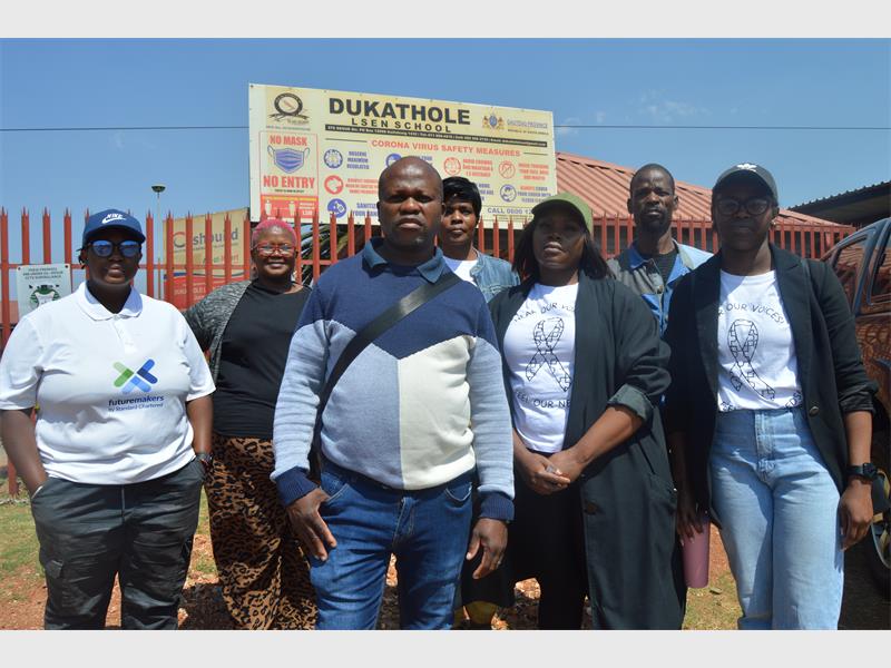 Outraged parents demand the removal of both the assistant educator and the principal following a controversial social media post, calling for action from the Department of Education.