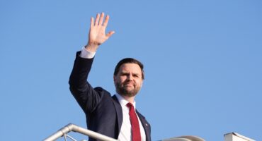 US Vice President JD Vance waves as he boards Air Force Two after attending talks on Iran in Islamabad on April 12, 2026.
