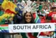 A South African fan cheers for her team during the 2026 World Cup Group A football match between South Africa and South Korea at the Monterrey Stadium in Guadalupe, Mexico, on June 24, 2026. (Photo by Julio Cesar AGUILAR / AFP)