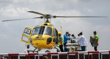 Medics and rescuers transfer mountaineer Dawa Sherpa from a helicopter upon his arrival at the HAMS Hospital in Kathmandu on June 4, 2026. Photo: AFP