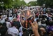 A Cockroach Janta Party (CJP) supporter holds a cockroach mask during a protest over alleged irregularities in the country's major examinations, in New Delhi on June 6, 2026. Photo: AFP