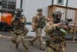 Immigration and Customs Enforcement (ICE) agents point less-lethal weapons toward protesters outside Delaney Hall, which is being used as an Immigration and Customs Enforcement (ICE) detention center, in Newark, New Jersey on June 6, 2026.