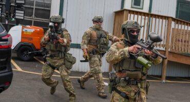 Immigration and Customs Enforcement (ICE) agents point less-lethal weapons toward protesters outside Delaney Hall, which is being used as an Immigration and Customs Enforcement (ICE) detention center, in Newark, New Jersey on June 6, 2026.