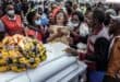 A relative hugs a portrait of a victim of the Utumishi Girls' Academy Senior School fire as she mourns with others during a memorial mass amid growing concern over a wave of school fires across Kenya at Gilgil Stadium in Gilgil, on June 12, 2026. Photo: AFP
