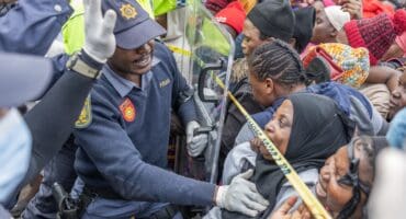 A file image of members Members of the South African Police Service (SAPS) prevent a stampede at Sherwood Park in Durban on June 13, 2026 as more than 7,000 people, mostly Malawian women nationals, queued for repatriation to Malawi. Photo: Rajesh JANTILAL / AFP