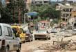 Vehicles line up along destroyed buildings as Lebanese soldiers set up a checkpoint in the southern village of Kafra, closing the road leading to the nearby village of Haris, where the Israeli military remains present, on June 15, 2026. Photo by KAWNAT HAJU / AFP