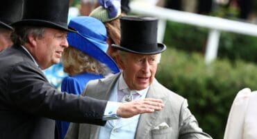 Britain's King Charles III talks with Francis Brooke on the fifth day of the Royal Ascot horse racing meeting in Ascot, west of London, on June 20, 2026. (Photo by Henry Nicholls / AFP)