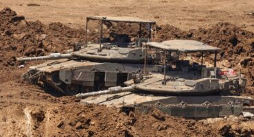 This picture taken from a position in the Upper Galilee in northern Israel shows Israeli tanks positioned along the border with southern Lebanon on June 22, 2026.