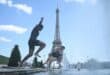 People jump in the Trocadero Fountain near the Eiffel Tower during a heatwave in Paris on June 22, 2026.