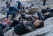 Rescuers and volunteers rest on the rubble of collapsed buildings in Caraballeda, La Guaira state, Venezuela, on June 28, 2026, following earthquakes.