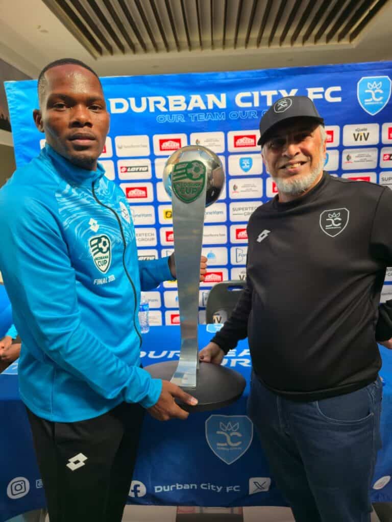 Durban City chairman Farook Kadodia and club vice captain Mfanafuthi Mkhize posing with their newly won Nedbank Trophy at the Scottsville Mall on Saturday. Photo: Chris Ndaliso