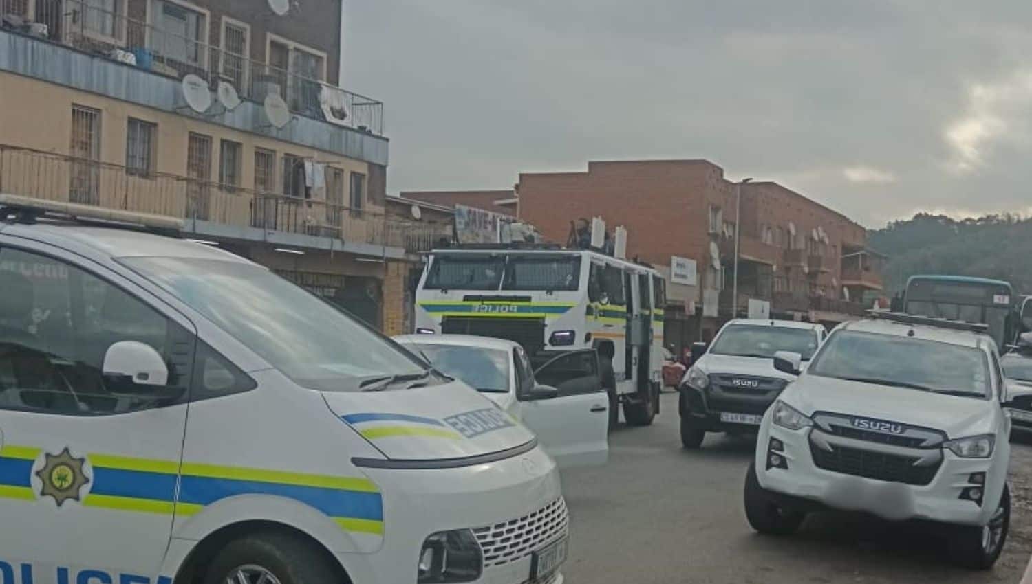 WATCH | Police disperse crowd at PMB hostel with stun grenades