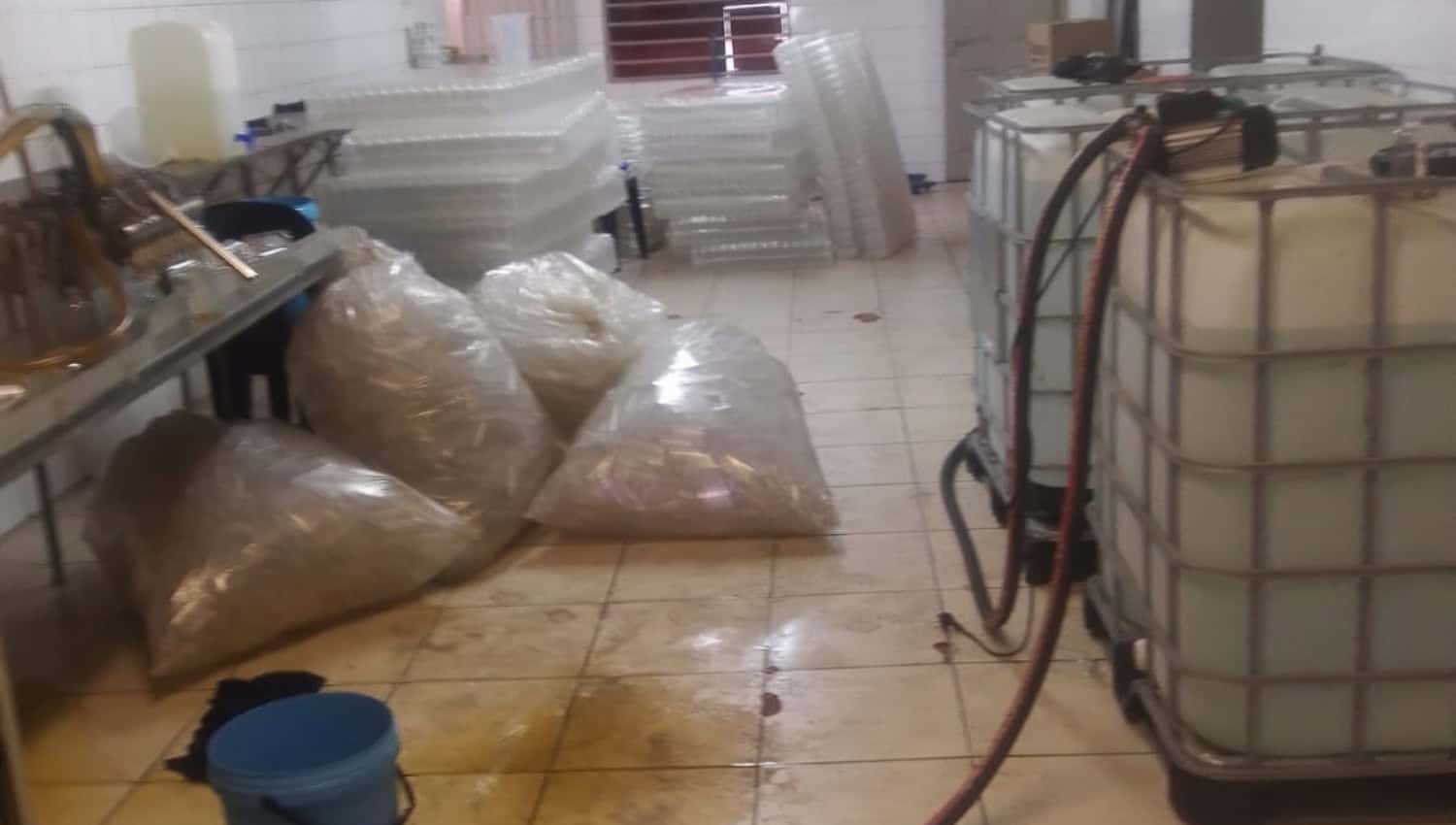 PICS | Seven undocumented foreign nationals arrested in over alleged illicit alcohol operation