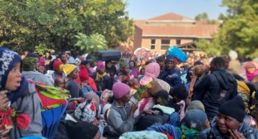 Malawian nationals line up to get onto the buses outside of the shelter they have been staying in. Photo Moeketsi Mamane
