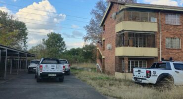 Multiple private security personnel on scene where a man was allegedly stoned to death. Photo: Moeketsi Mamane