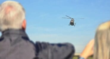 Spectators watch on as a chopper shows off some maneuvers at the Fuze Pietermaritzburg Airshow. Photo: Moeketsi Mamane