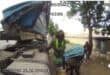 Two men are seen siphoning fuel from a tanker. Photo: KZN Department of Transport