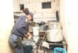 A police woman inspects a kitchen in the crackdown. Photo: KZN SAPS