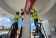 Workers secure a gas station ahead of the arrival of the forecasted Super Typhoon Bavi in Saipan, Northern Mariana Islands, on July 3, 2026. Photo: AFP