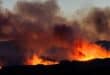This photograph shows a wildfire burning in the Aspres region seen from Millas, in the Pyrenees-Orientales department, southern France on July 5, 2026.