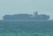 This frame grab taken from AFPTV video footage on July 12, 2026 shows a cargo ship anchoring near the Strait of Hormuz off the eastern coast of the United Arab Emirates at Khor Fakkan.