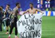 Argentina's defender #19 Nicolas Otamendi (L) and midfielder #11 Giovani Lo Celso show a banner that reads in Spanish, "The Malvinas (Falkland Islands) belong to Argentina," after winning the 2026 World Cup football tournament semi-final match between England and Argentina at the Atlanta Stadium in Atlanta on July 15, 2026. Photo: AFP