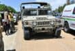 A Lebanese army vehicle drives past first responders near the entrance to the southern village of Zawtar al-Gharbiya as troops deploy to the village on July 21, 2026.