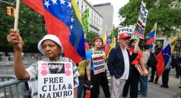 Demonstrators hold signs in support of ousted Venezuelan president Nicholas Maduro and his wife Cilia Flores, outside the Daniel Patrick Moynihan Federal Courthouse in New York City on July 22, 2026.