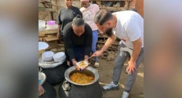 IFP PR Councillor Shamiell Ally assists with preparing and handing out food to the residents of Jika Joe who were affected by the recent fire. Photo Supplied