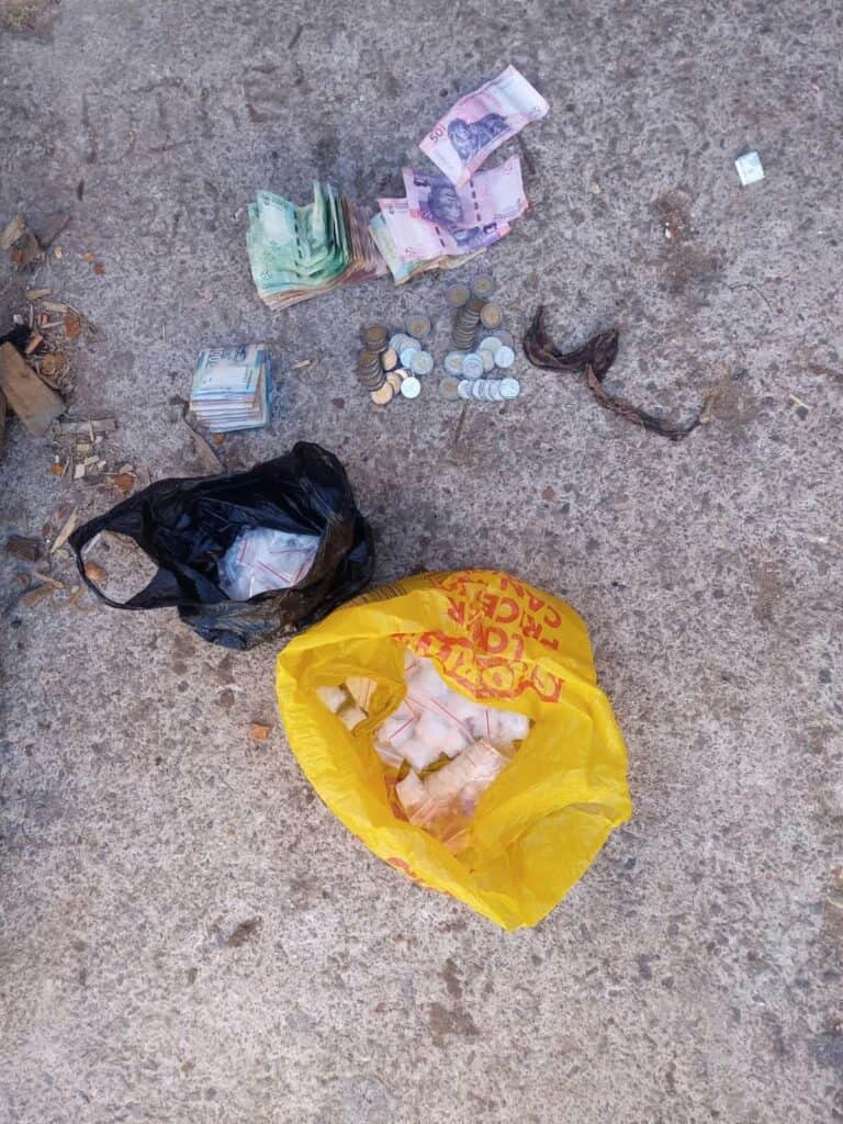 Undisclosed amount of cash seized after Nigerian national arrested in operation. Photo: SAPS/Facebook