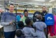 Marrc CEO Anthony Waldhausen, Jika Joe Informal Settlement community Zodwa Ngcobo and IFP PR Councillor Shamiell Alliey assist pupils to fit uniforms at the Prime Store on Church Street. Photo: Shorne Bennie