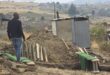 A family member prepares a plot of ground to bury Nonjabulwenhle Nzimande. The child's body was discovered in a veld not far from her home on Tuesday. Photo Shorne Bennie