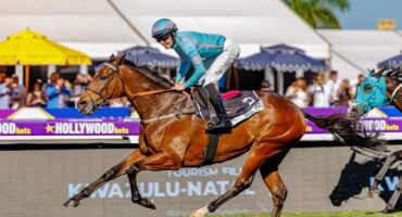 Zac Lloyd, jockey for Magic Verse power to victory. Photo Hollywoodbets/X