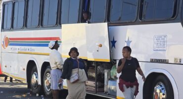 Zimbabwean nationals in Havelock Road are boarding a bus back to their country. Photo: Chris Ndaliso
