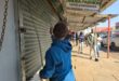 A man closes a business in Pietermaritzburg's CBD on Wednesday ahead of Thursday's planned March and March demonstration targeting businesses allegedly operated by undocumented foreign nationals. Photo: Moeketsi Mamane